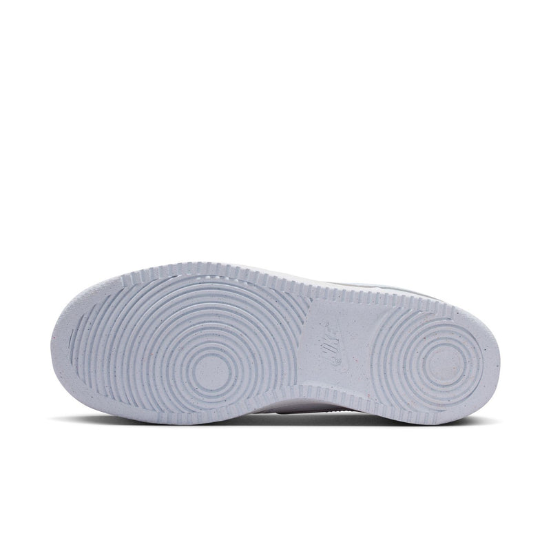Women's low-top sneaker outsole, light gray rubber tread with circular pattern.