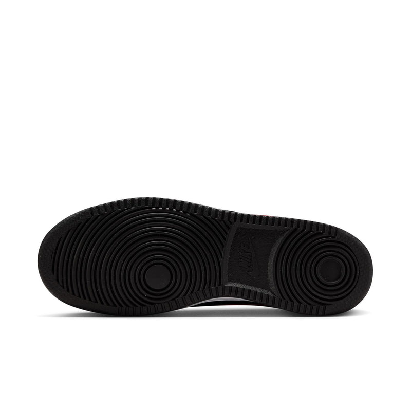 Women's sneaker outsole in black rubber with circular traction tread.