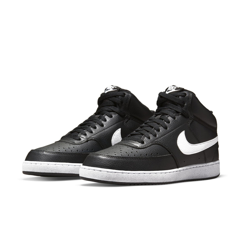 Pair of black mid-top sneakers with white Swoosh and lace-up design