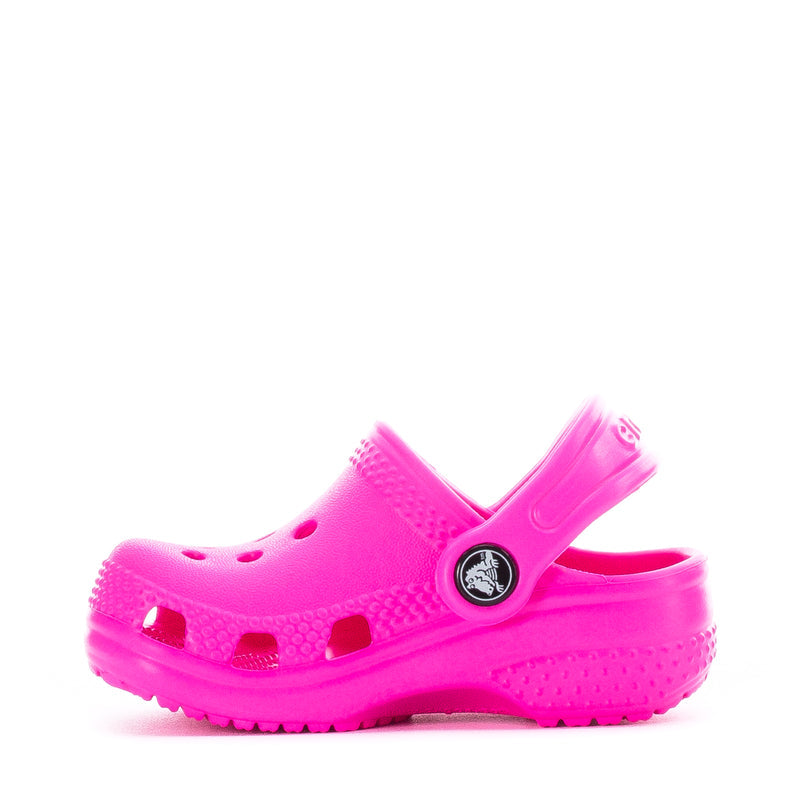Bright pink infant Crocs clog with adjustable heel strap and vent holes