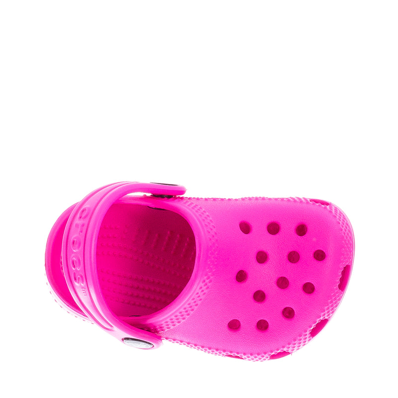 Bright pink infant Crocs clog viewed from inside opening with perforated upper