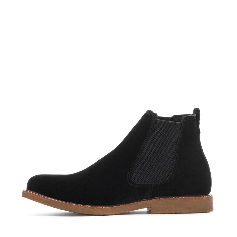 Men's black chelsea boots with elastic side panel and tan sole