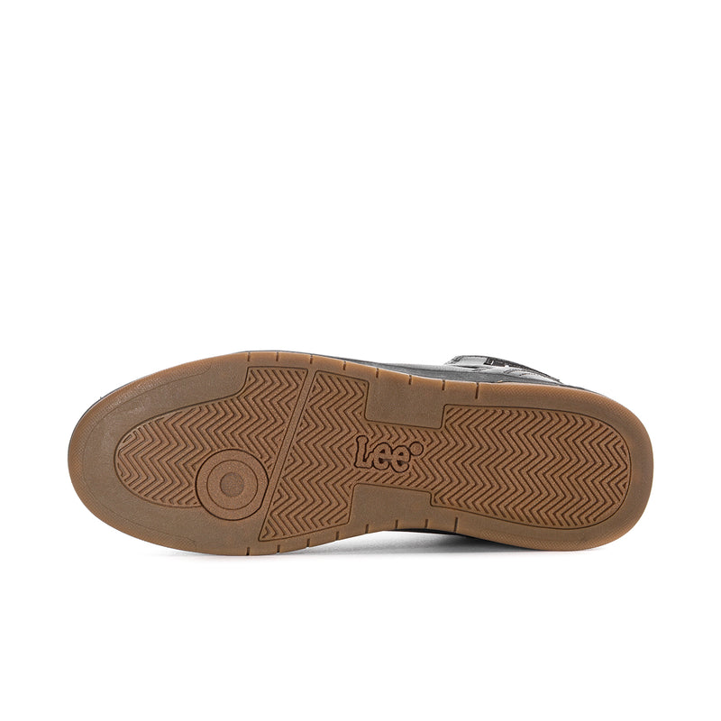 Gum rubber outsole for black high-top sneakers with circular tread logo