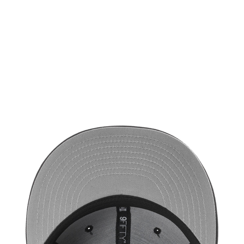 Gray underside and stitched interior of a black baseball cap
