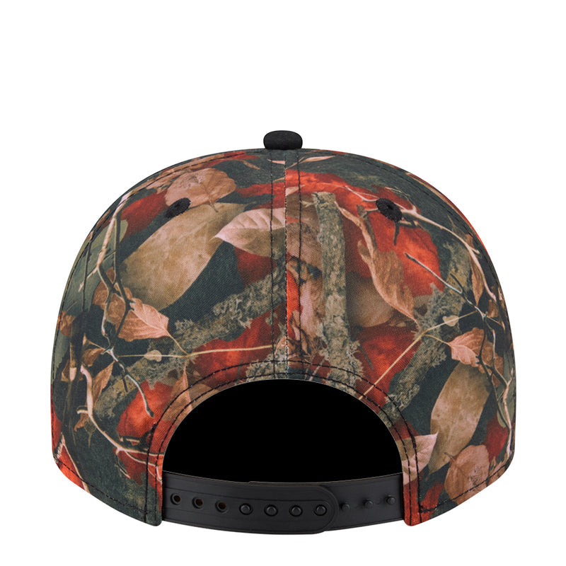Tree camo A-frame cap with black interior and stitched eyelet vents on back