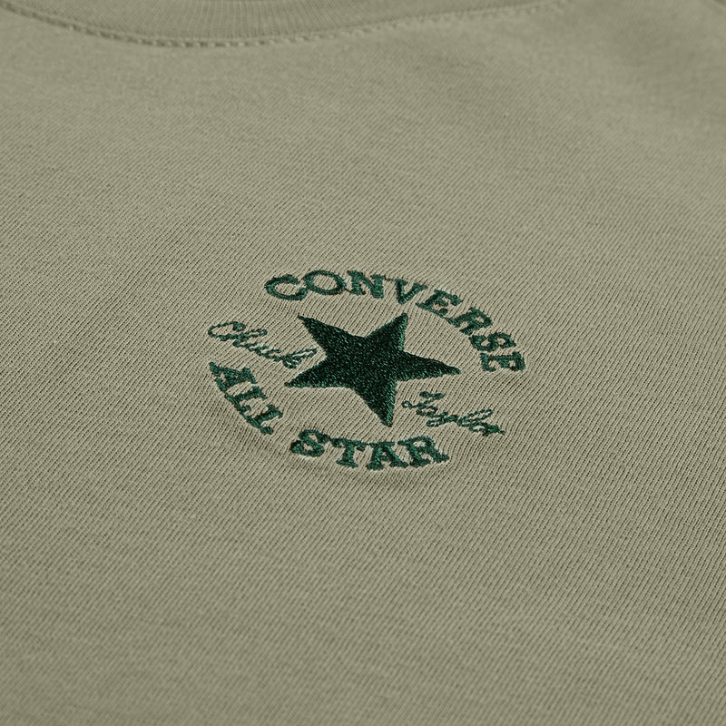 Youth olive green tee close-up of embroidered circular logo on chest