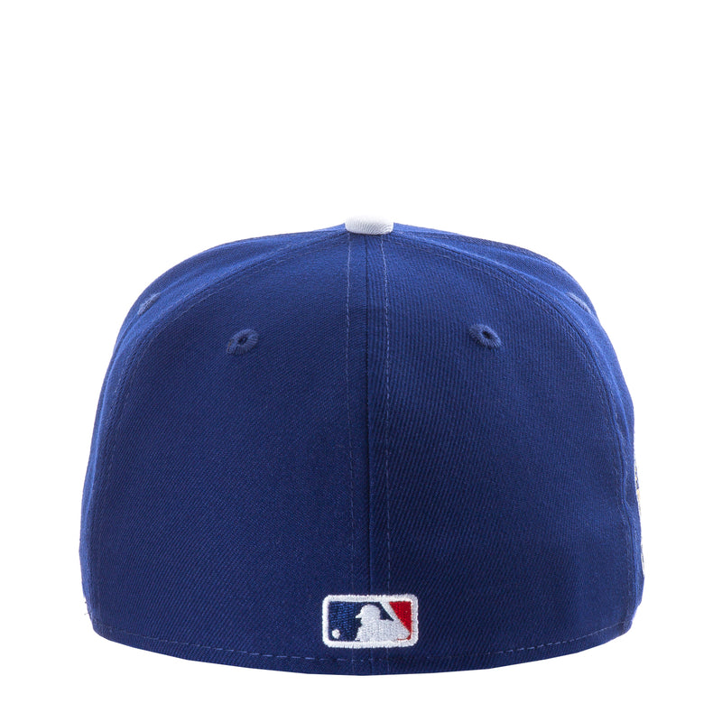 Royal blue baseball cap with MLB logo patch on back panel.
