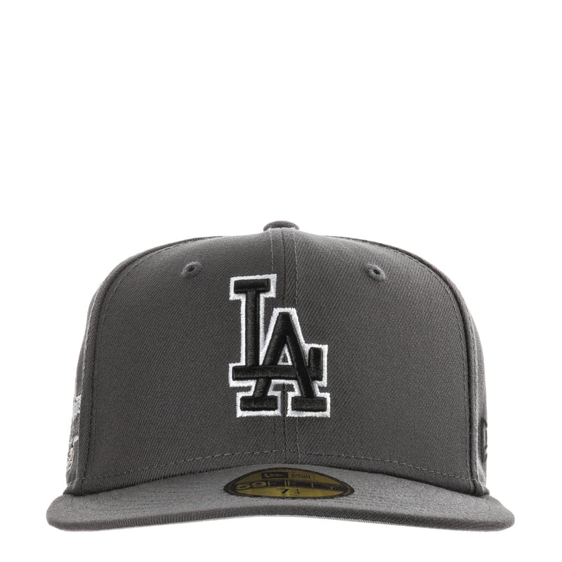 Dark graphite baseball cap with large white-outlined LA logo on front panel