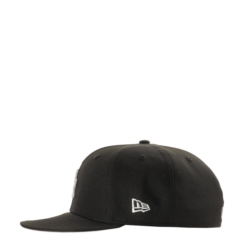 Black baseball cap with New Era logo on front