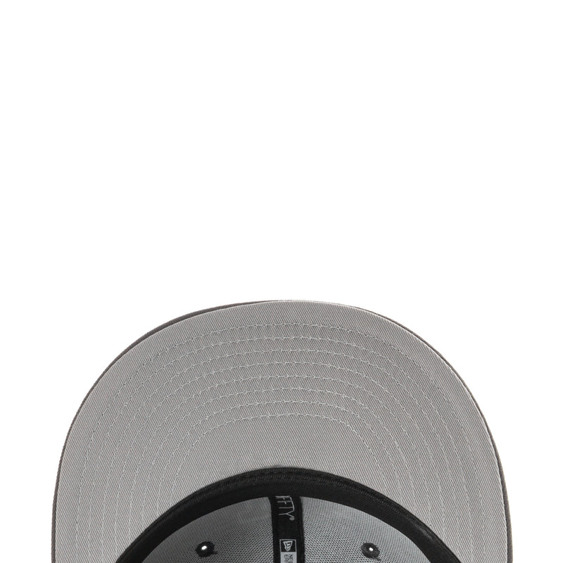 Baseball cap underside view with stitched brim and dark inner band