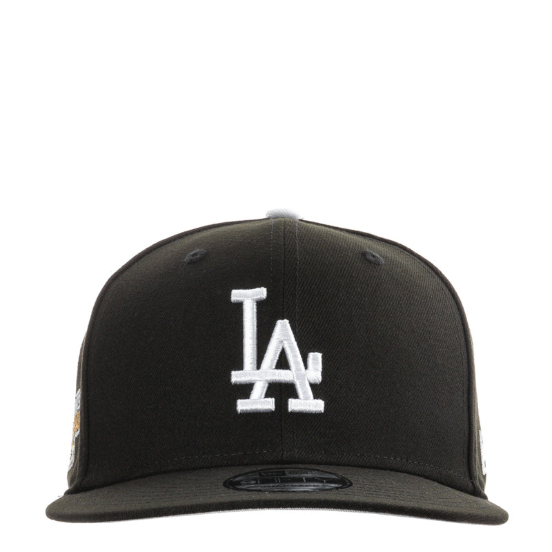 Black baseball cap with white LA logo on front