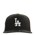 Black baseball cap with white LA logo on front
