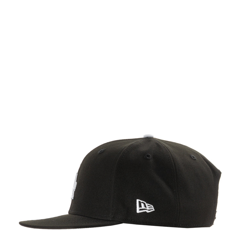 Black baseball cap with New Era logo on side