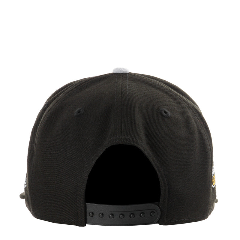 Black baseball cap back view with snapback strap and ventilation eyelets