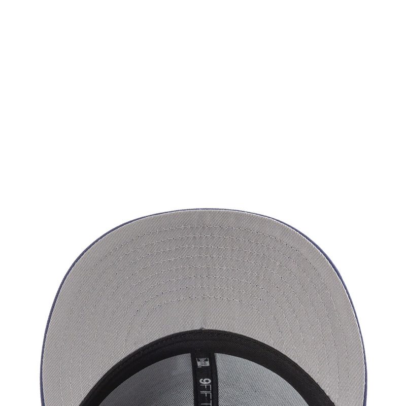 Gray inner underside of baseball cap with black brim edge