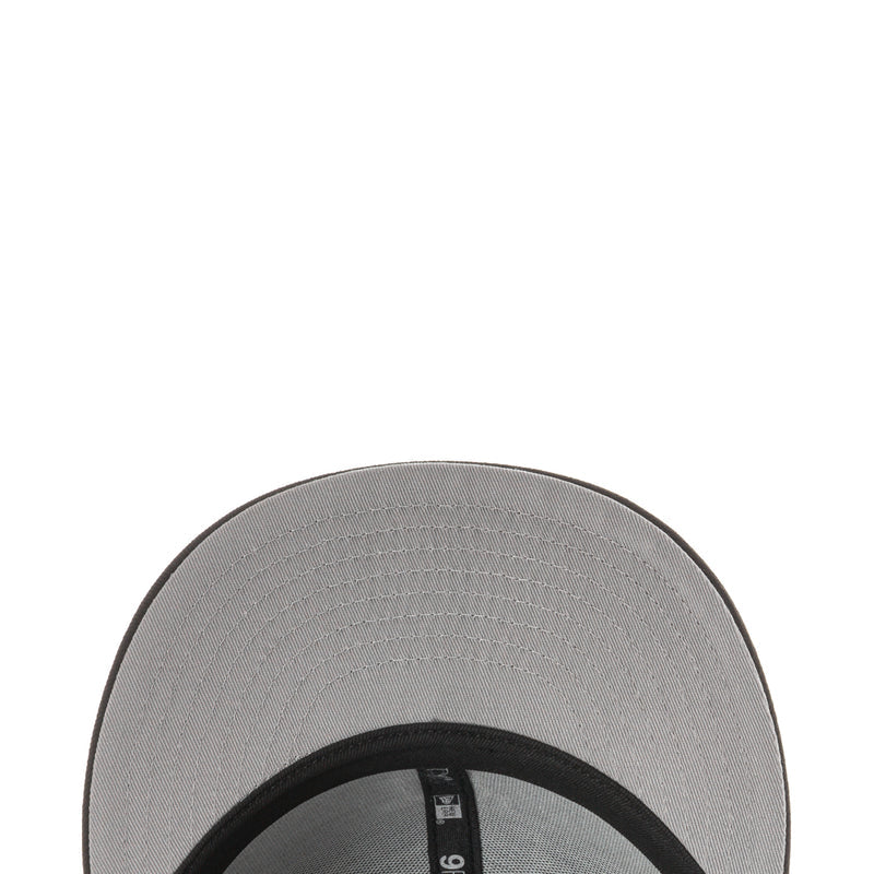 Light gray underside of baseball cap brim with black inner band