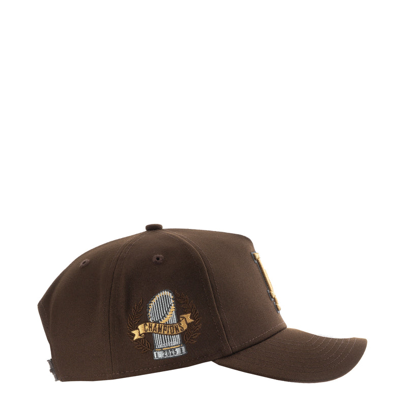 Brown A-frame baseball cap with side embroidered trophy and World Series patch