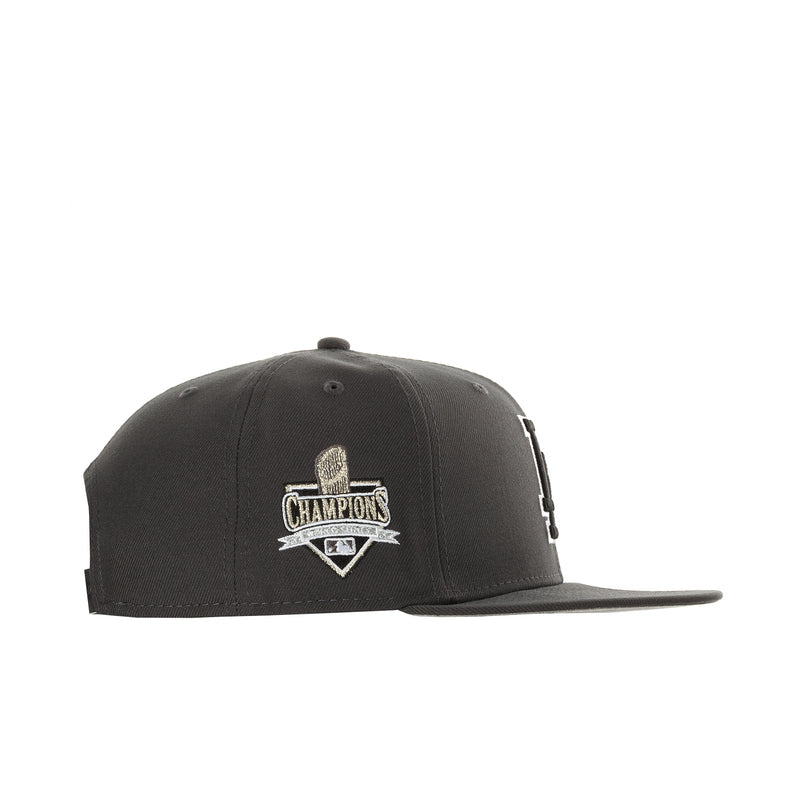 Dark graphite baseball cap with Champions Trophy side patch on left