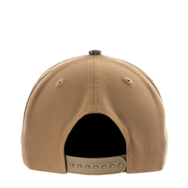 Tan baseball cap back view with adjustable strap holes and dark inner panel