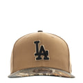 Desert tan baseball cap with LA logo and camo-pattern brim