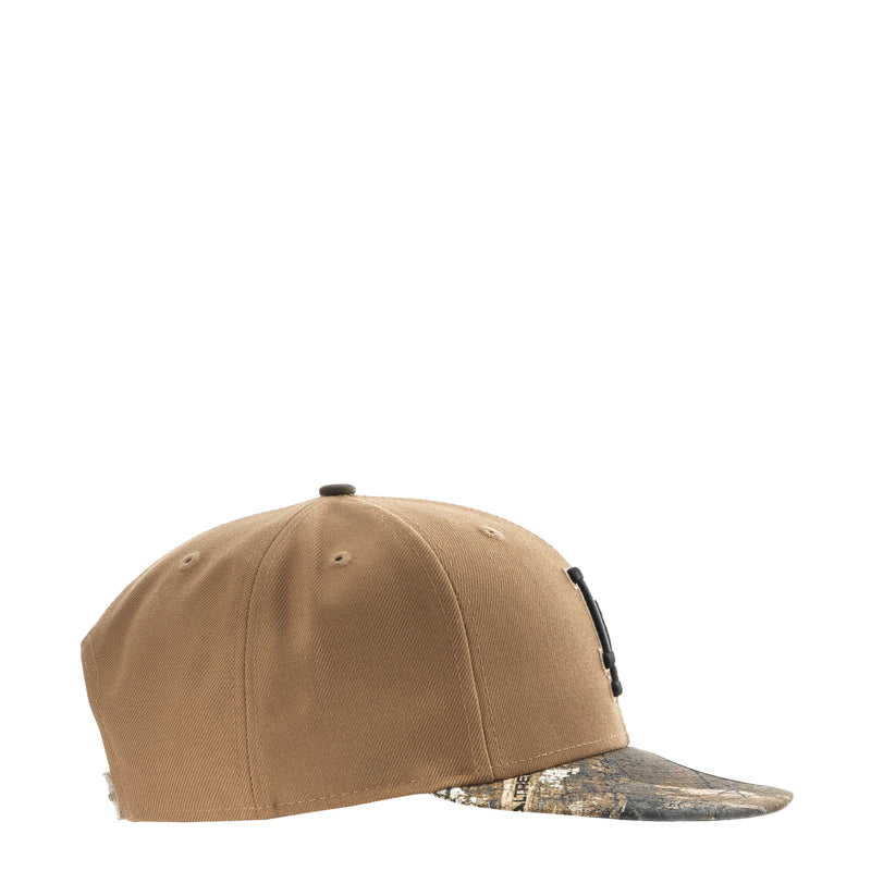 Desert tan baseball cap with camo-pattern brim, side view