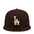 Brown baseball cap with white LA logo on front and dark brim