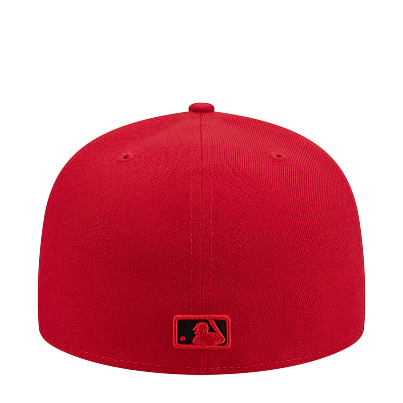 Red baseball cap with rear MLB logo patch below the seam