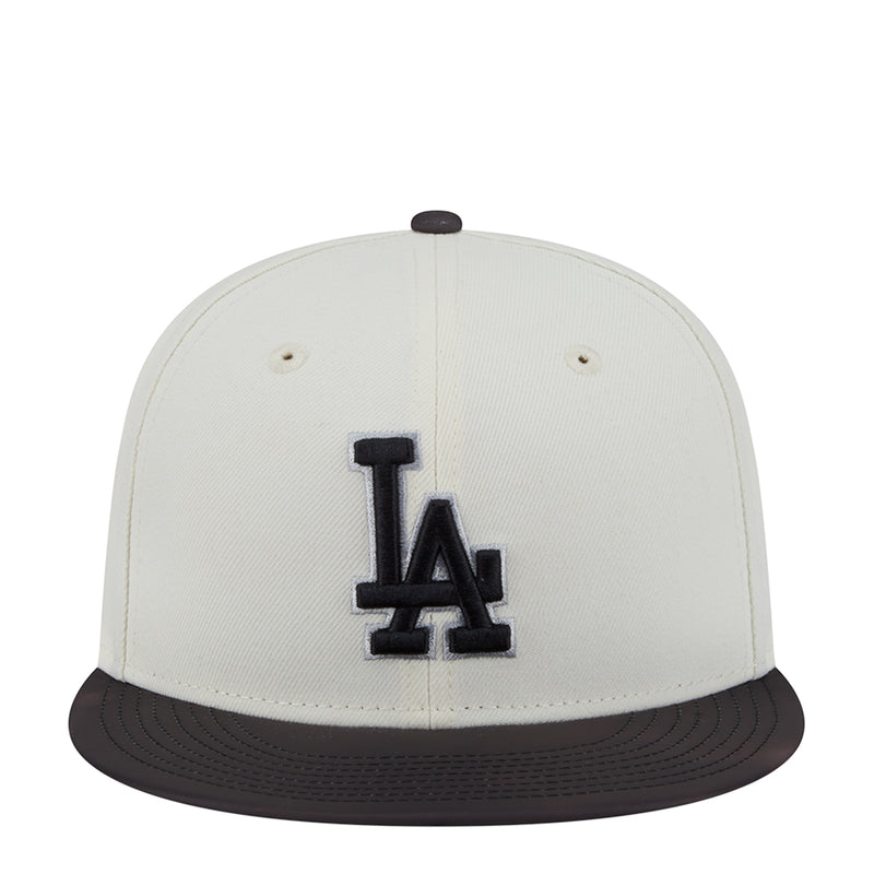 Two-tone baseball cap, white crown with black LA logo and black brim