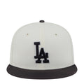 Two-tone baseball cap, white crown with black LA logo and black brim