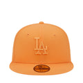 Orange baseball cap with raised LA logo and New Era side patch