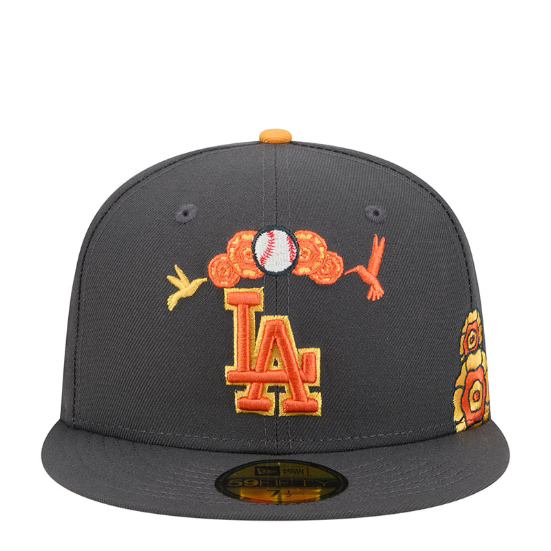 Dark grey snapback cap with orange top button and embroidered LA logo, plus Dia de Muertos-style accents