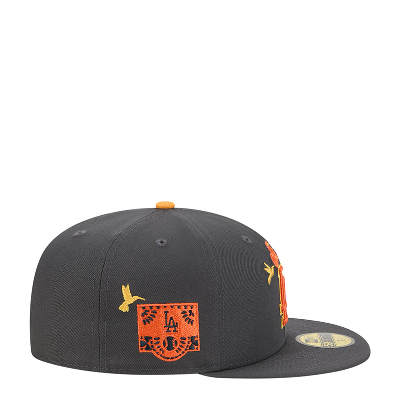 Dark grey snapback cap with embroidered square LA crest patch and orange-yellow floral accents
