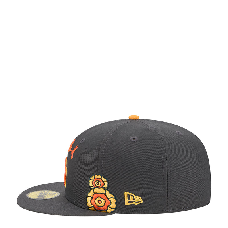 Dark grey snapback cap with orange-yellow flower embroidery and New Era logo on side