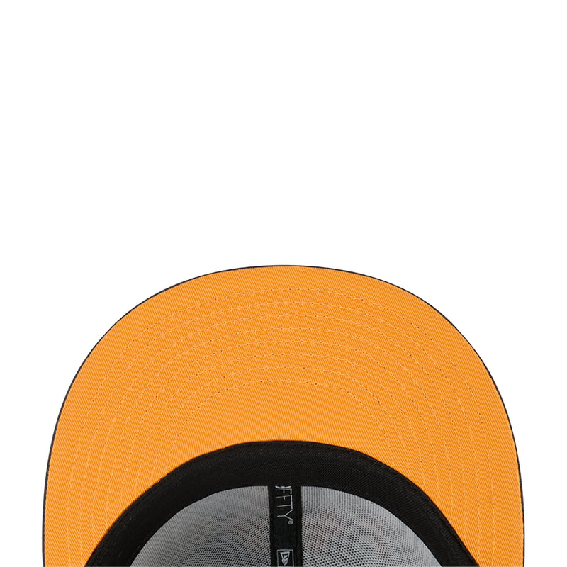 Orange cap top with black inner band and visible seam stitching
