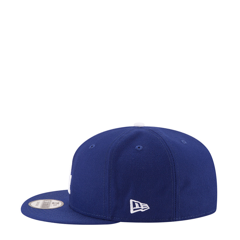 Royal blue baseball cap with New Era logo patch on side.
