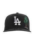 Black baseball cap with white LA logo and colorful palm tree embroidery on front