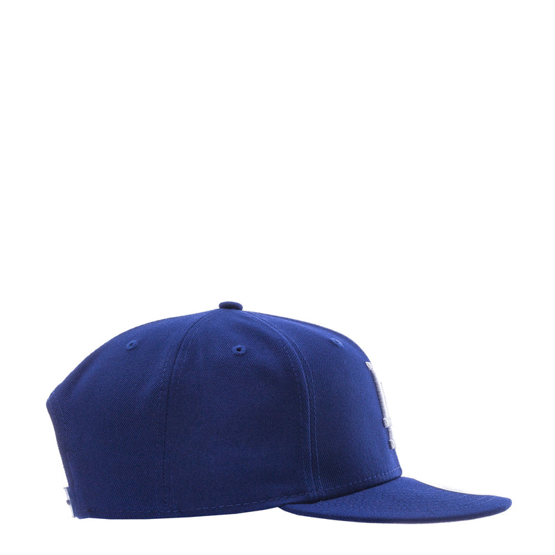 Royal blue baseball cap with curved brim and stitched back panel