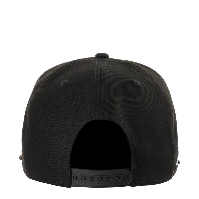 Black baseball cap with curved brim and snapback strap at back