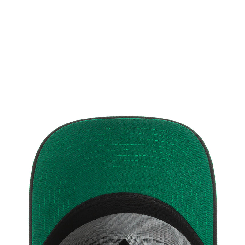Green A-frame cap underside with black brim edge and stitched interior panel