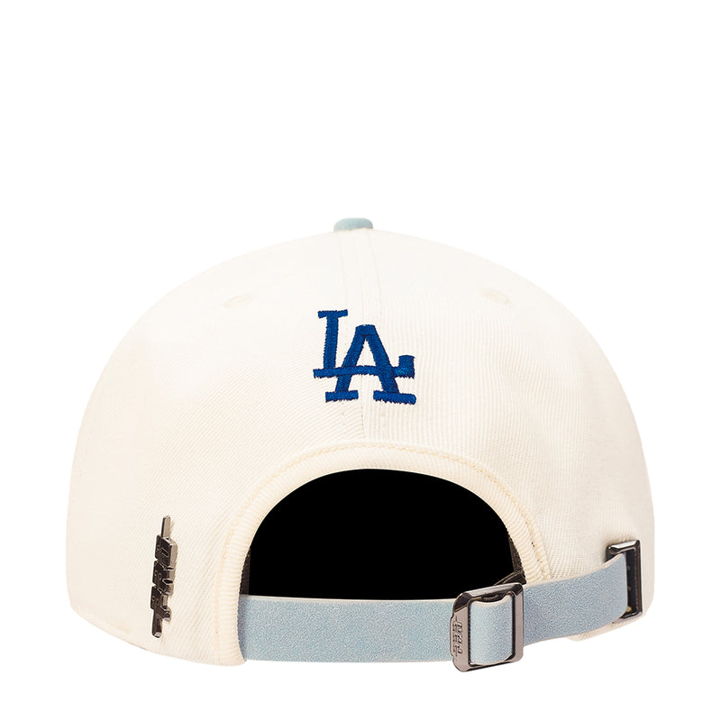 White baseball cap with LA monogram and adjustable buckle strap