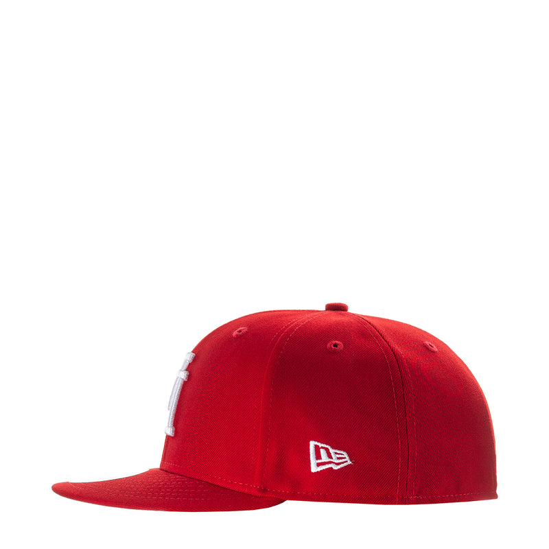 Red baseball cap with New Era logo patch on front
