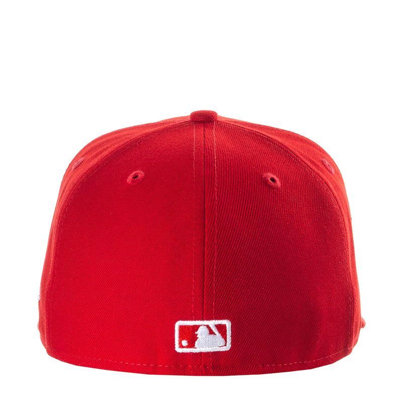 Red baseball cap with rectangular white logo patch centered