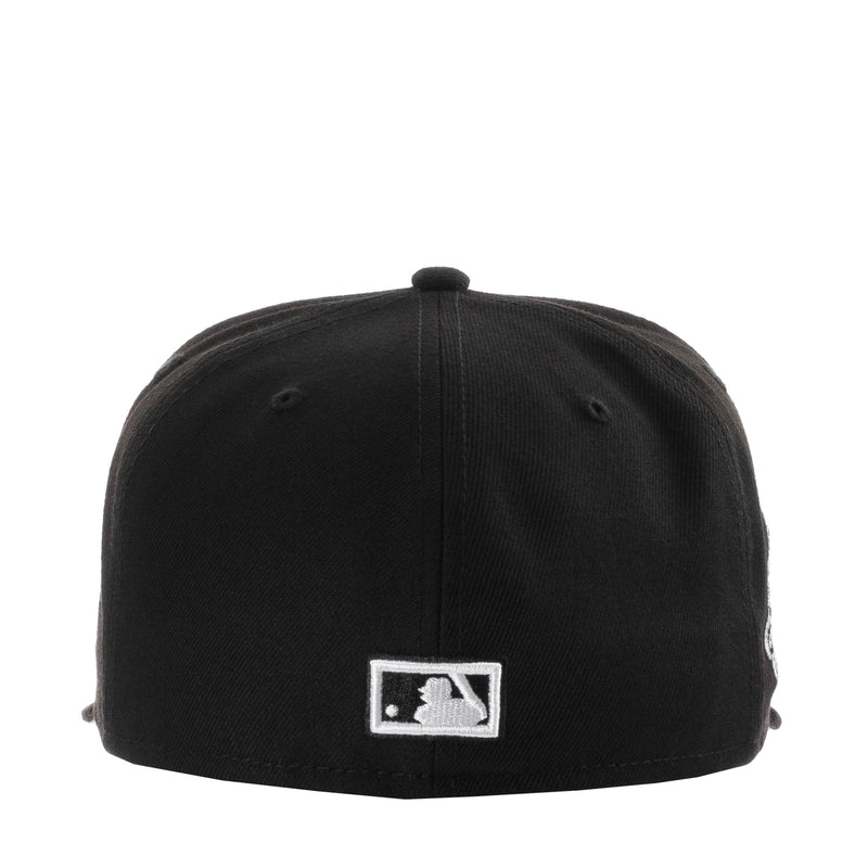 Black baseball cap with white batter emblem patch