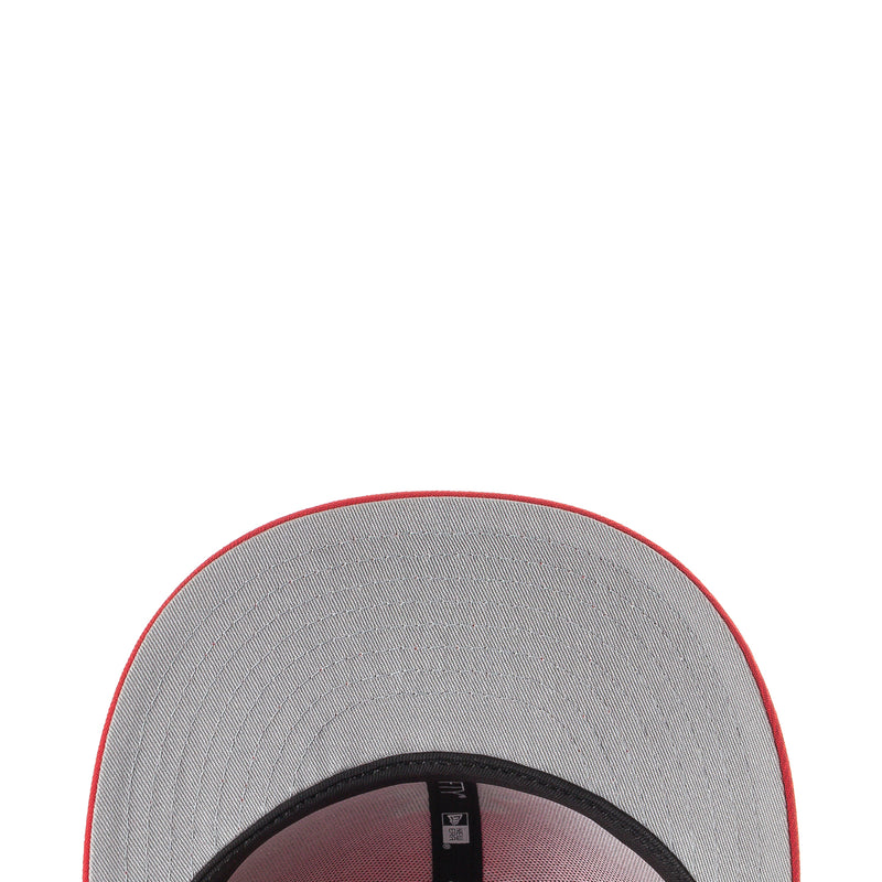 Baseball cap interior with gray lining and red brim edge