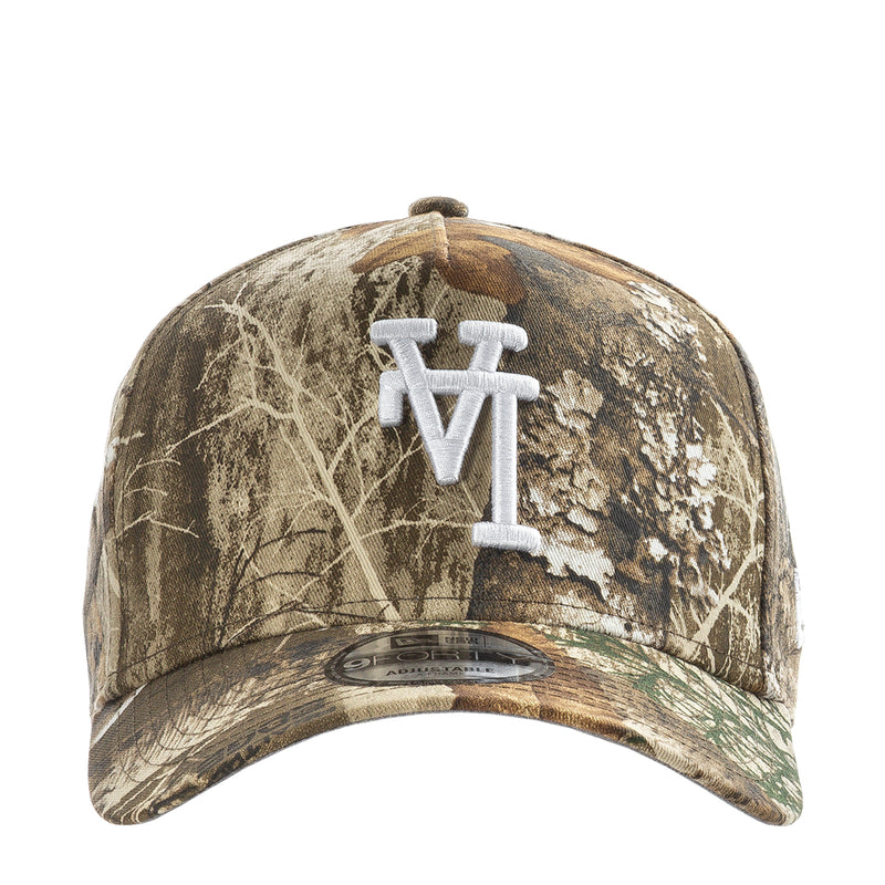 Real Tree camo baseball cap with light blue upside-down Dodgers logo