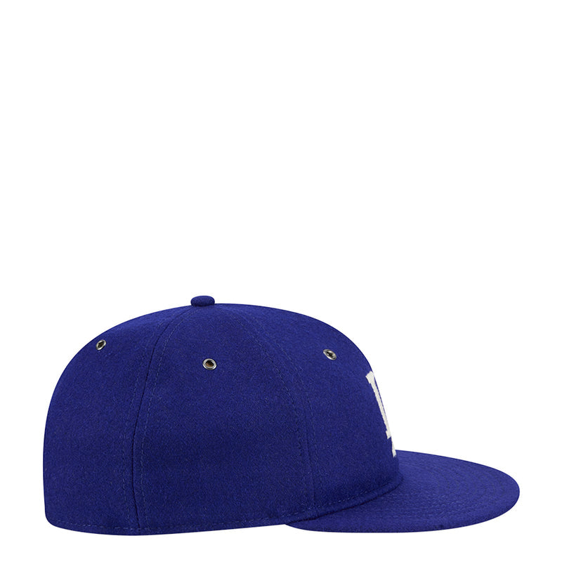 Royal blue baseball cap with side embroidery and metal eyelets