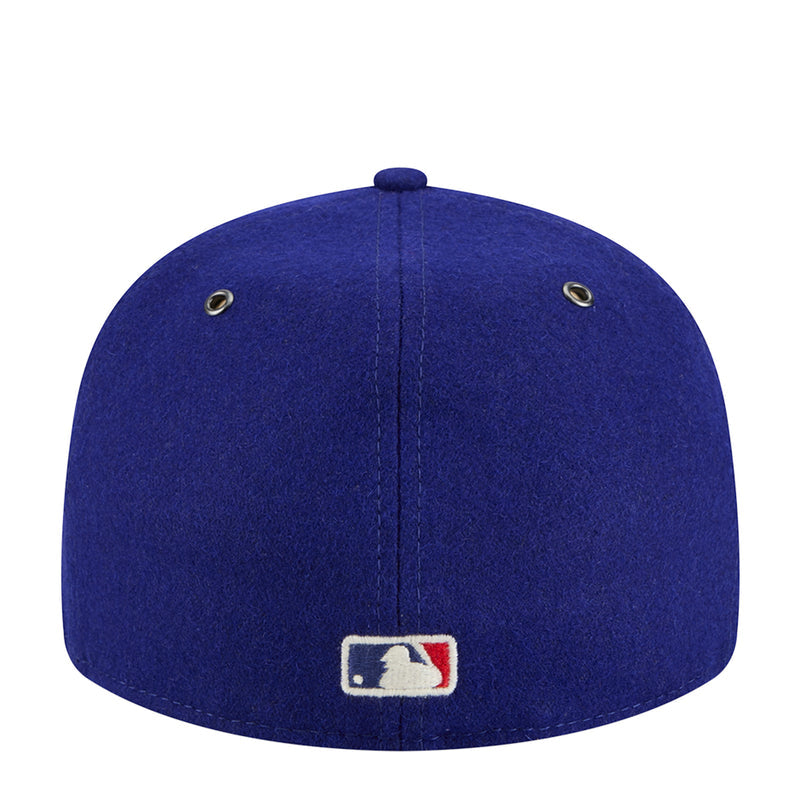 Royal blue baseball cap with vertical seam and MLB-style logo on brim
