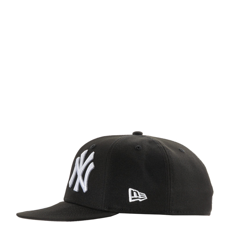 Black baseball cap with NY side logo and New Era flag logo