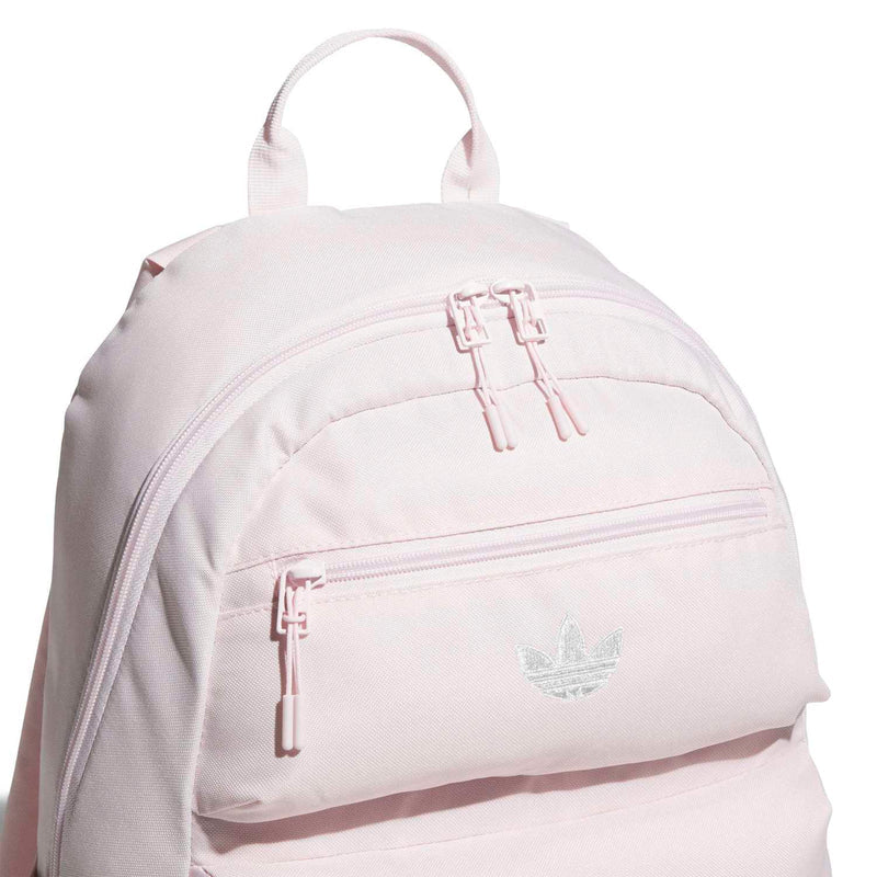 Light pink double-stacked backpack front panel with dual zippers and small bird logo.