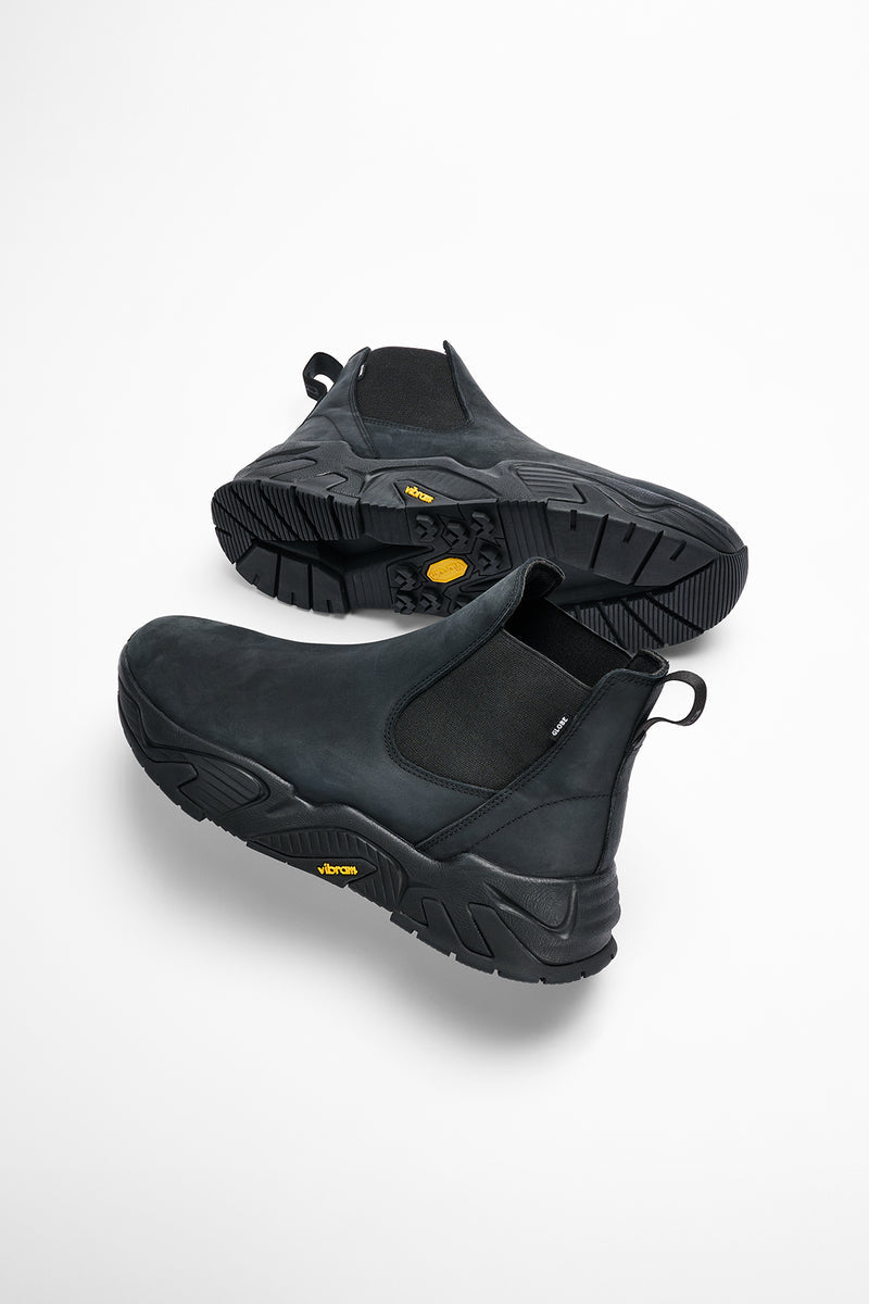 Angled shot of black Dover 2000 slip-on boots with stretch panels and chunky tread outsole
